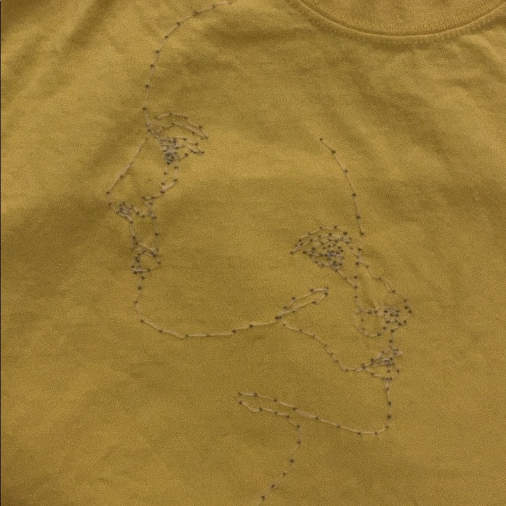 yellow t shirt! i sewed a design on it.
